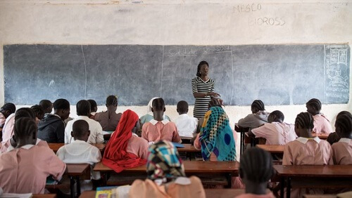 Teacher in class teaching